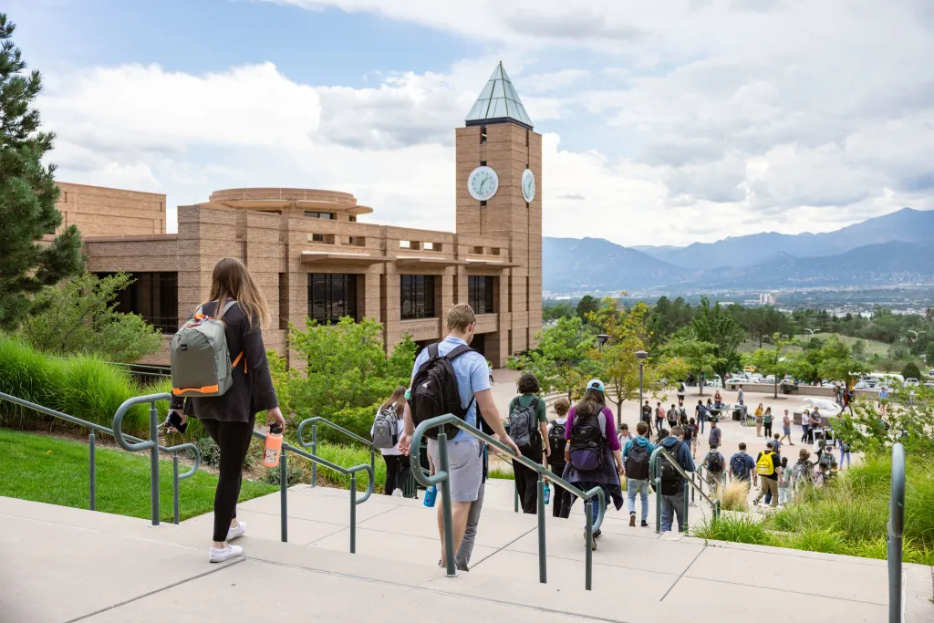 Students walking towards UCCS clocktower